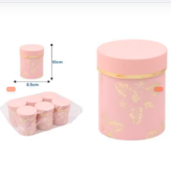 CAJA DE REGALO CIRCULAR ROSA CON HOJAS DORADAS